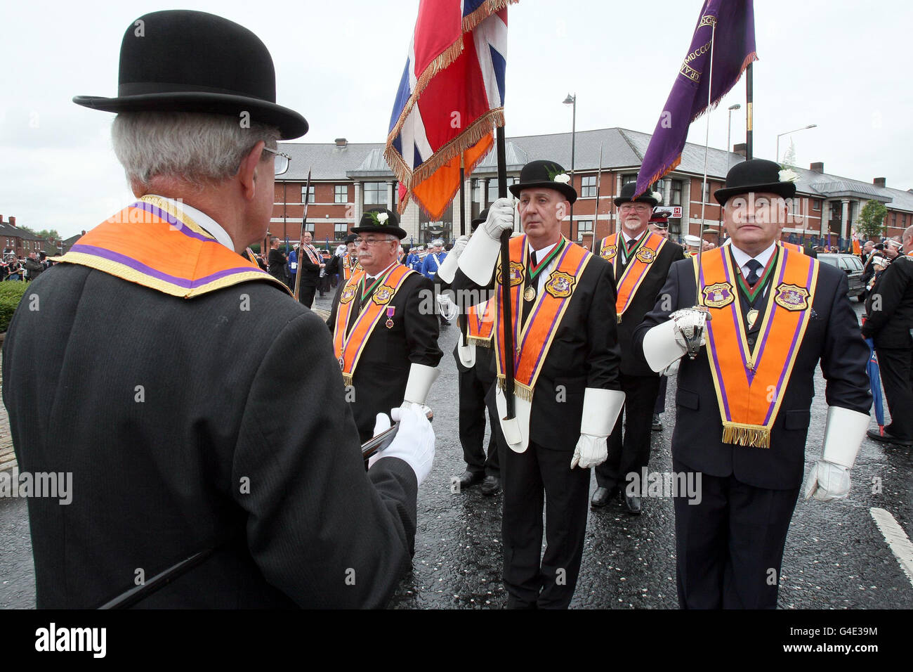 Orangemen gather at Carlisle Circus in Belfast as Orangemen celebrate the Twelfth of July which commemorates the 1690 Battle of the Boyne victory of a Protestant over a Catholic monarch. Stock Photo