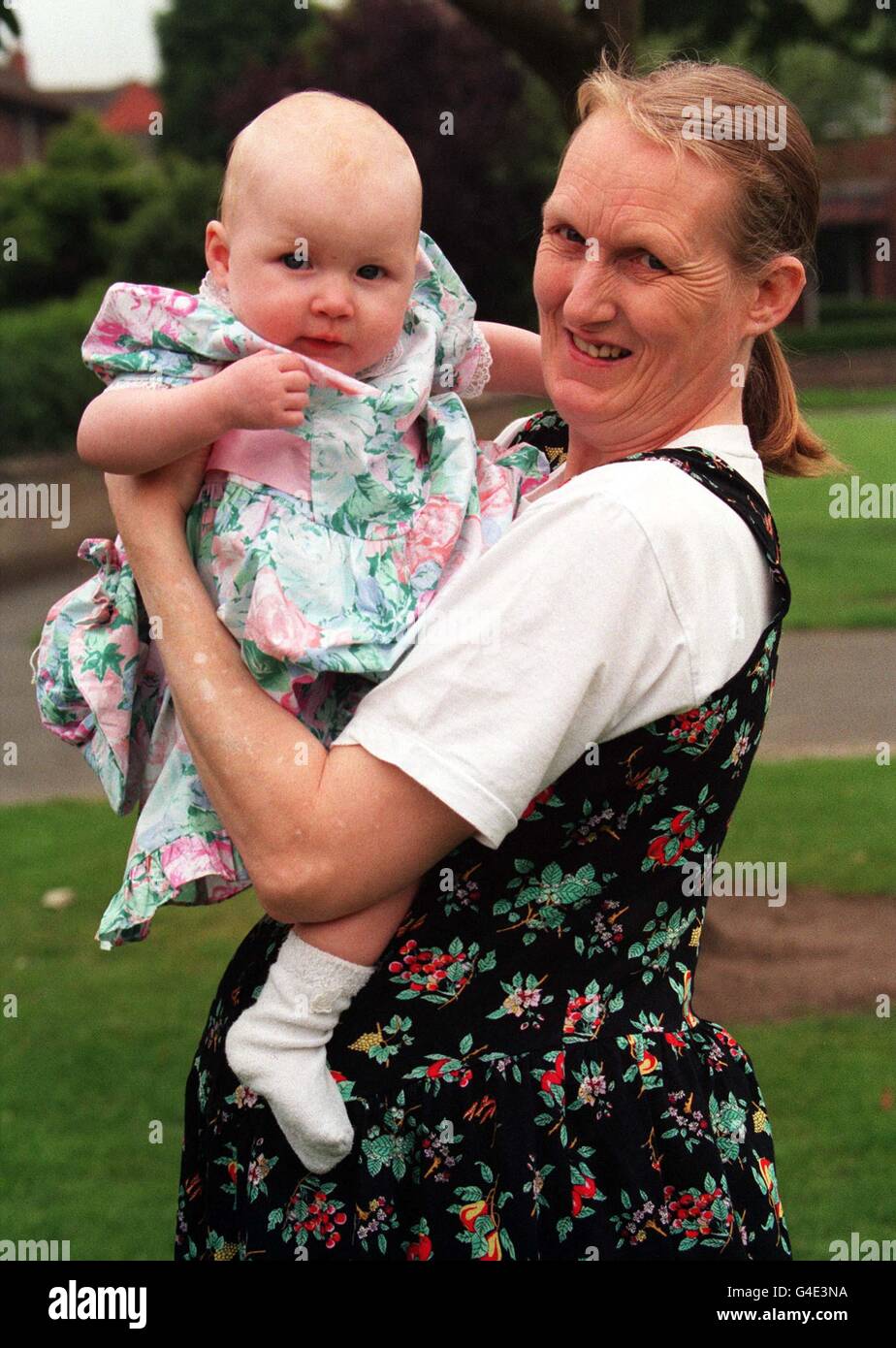 Note to Editors: This picture transmitted 17 August 1998 to accompany package of stories in advance of the first anniversary of the death of Diana, Princess of Wales. Susan Eyres, of Northwich, Cheshire, with her baby whom she named Diana when she was born just hours after the death of Diana, Princess of Wales, in a car crash twelve months ago. Pic Dave Kendall. Stock Photo