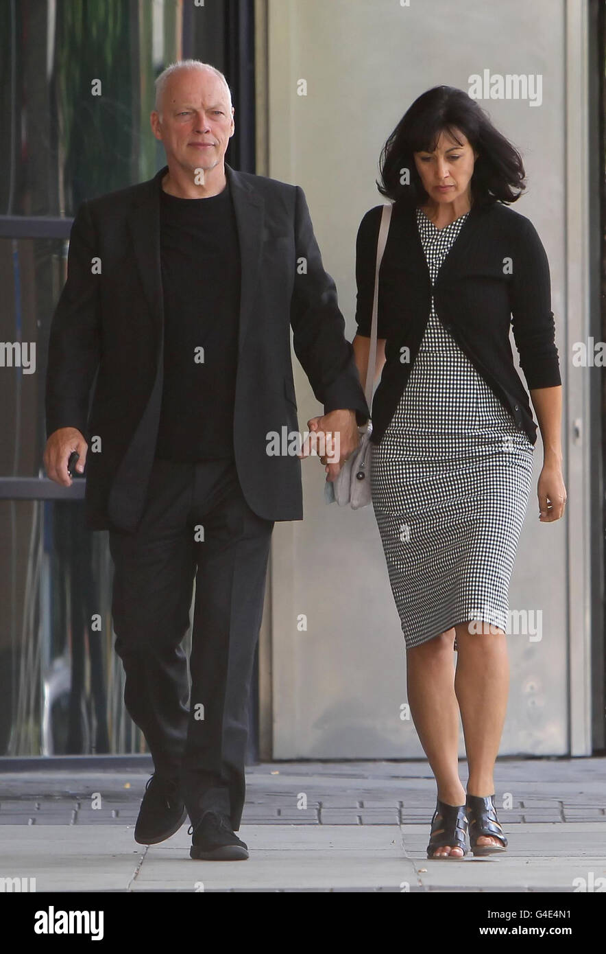 David Gilmour and his wife Polly Samson leave Kingston Crown Court following the sentencing of their son Charlie Gilmour who has been jailed for 16 months for going on a drink and drug-fuelled rampage at a student fees protest. Stock Photo