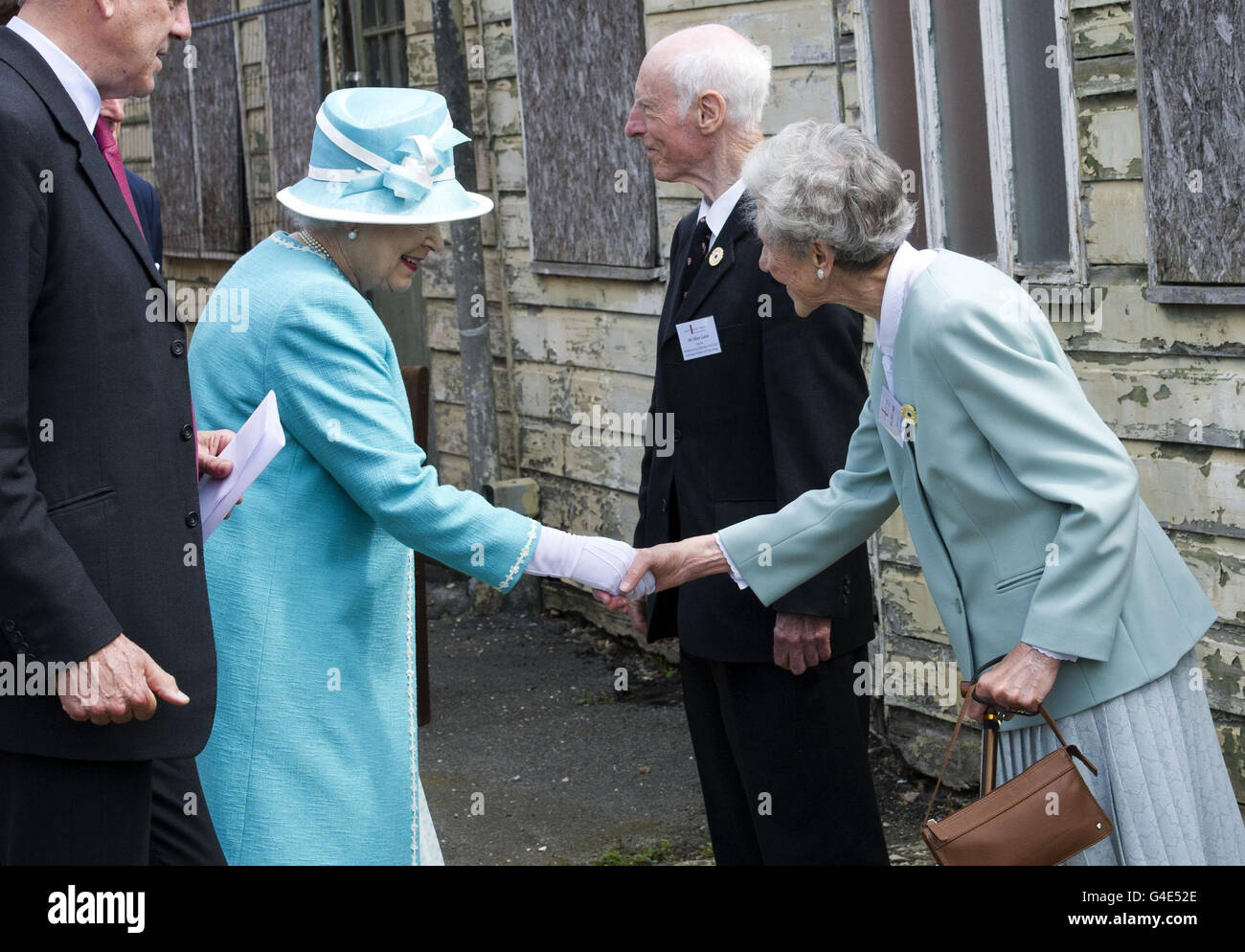 Queen Elizabeth II meets wartime cryptologists Oliver and Sheila Stone during a visit to Bletchley Park, Milton Keynes. Stock Photo