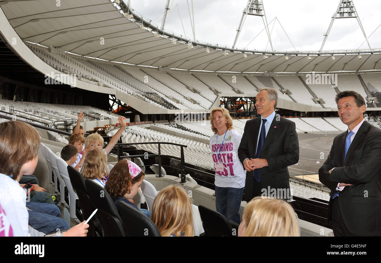 Tony Blair, the former Prime Minister pictured with London 2012 Organising Committee Chairman Sebastian Coe answer questions from schoolchildren from the north east of England, who are competition winners in the Tony Blair Sports Foundation. The children got the chance to see the nearly completed Olympic Park in Stratford, east London, this afternoon. Stock Photo