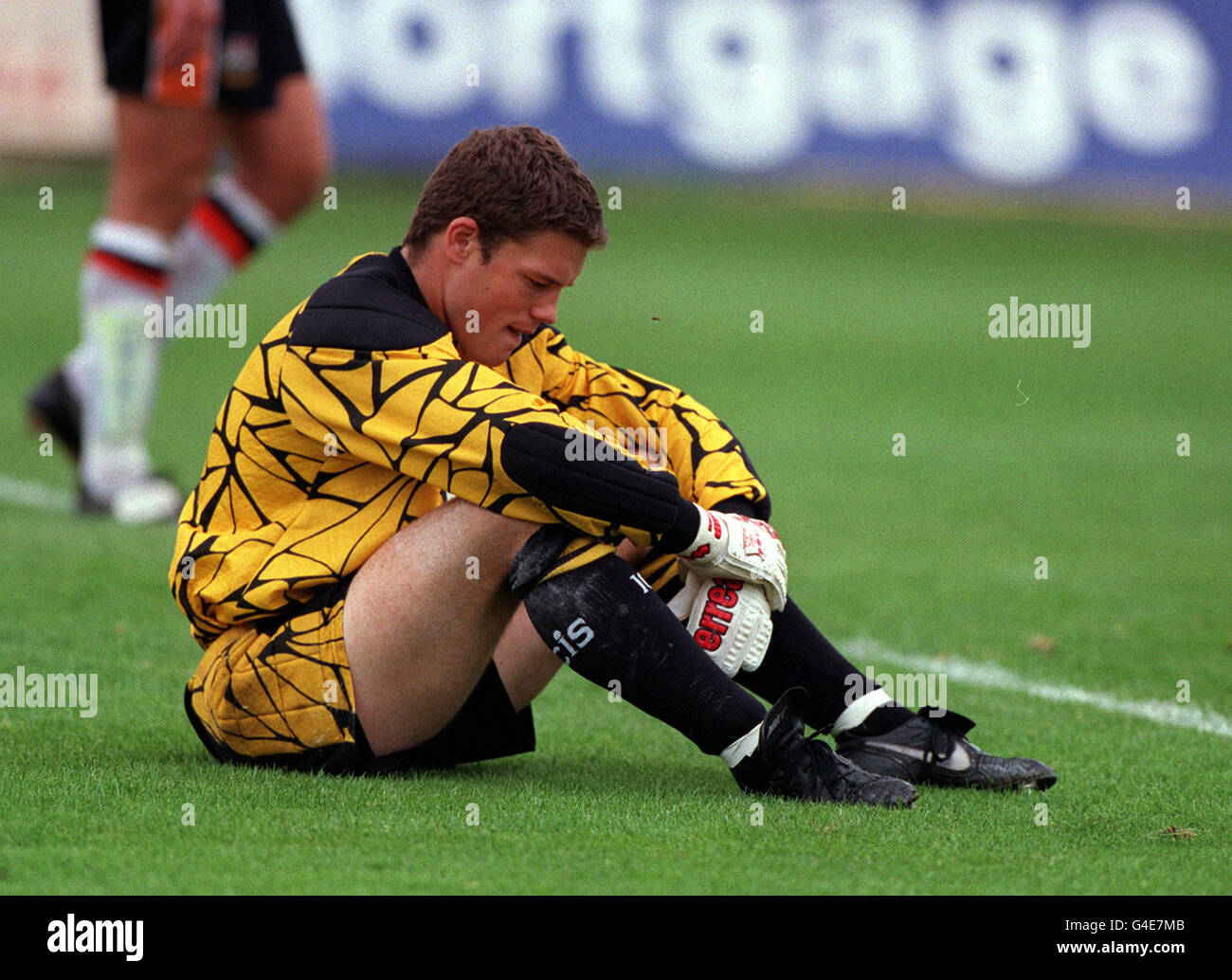 Barnet goalkeeper Nicky Rust hangs his head in despair during their ...