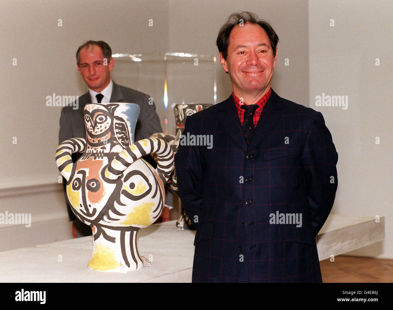 Claude Picasso (right) and Bernard Ruiz Picasso, son and grandson of Pablo Picasso oversea the installation of Picasso ceramics at the Royal Academy in London today (Monday) ahead of the show's opening on September 17. The exhibition sponsored by Goldman Sachs includes 174 unique pieces many of which have not been seen before. The ceramics shown are Owl and head of a faun, 3 February 1961 (front ) and Owl and head of a faun 9 March 1961. Photo by Rebecca Naden /PA Stock Photo