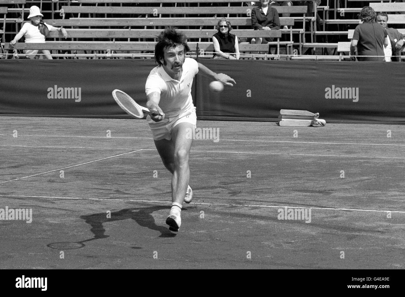 Stanley Matthews, son of footballing legend Stanley Matthews, in action against J. Rouyer from France. Stanley Matthews won the match 6-1 4-6 6-4 in the Men's Open Singles. Stock Photo