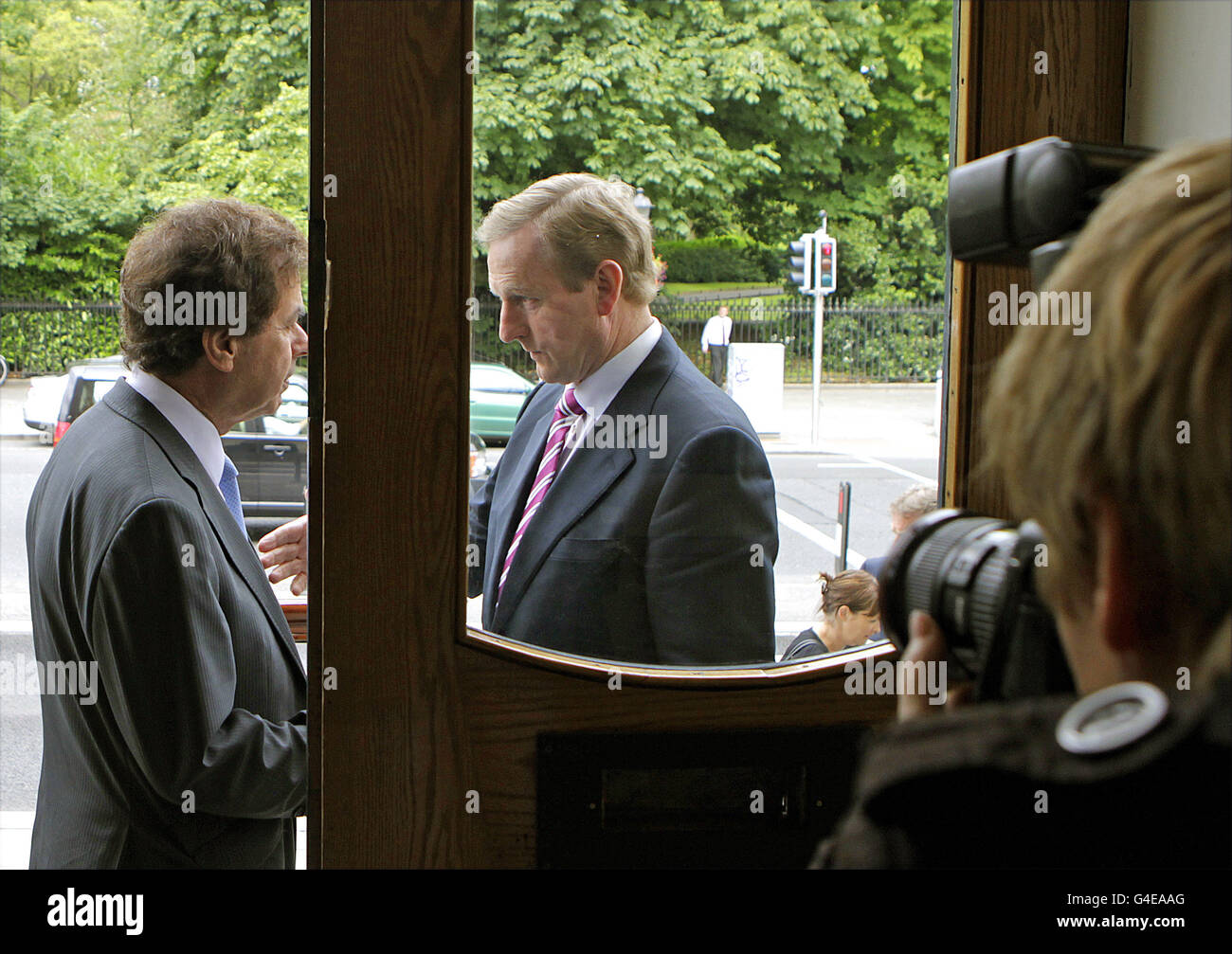 Taoiseach Enda Kenny (right) and Minister for Justice Alan Shatter (left) talk outside the launch of the first Irish Short-stay Visa Waiver Programme at the Department of Justice, St Stephen's Green, Dublin. PRESS ASSOCIATION Photo. Picture date: Thursday June 30, 2011. Photo credit should read: Julien Behal/PA Wire Stock Photo