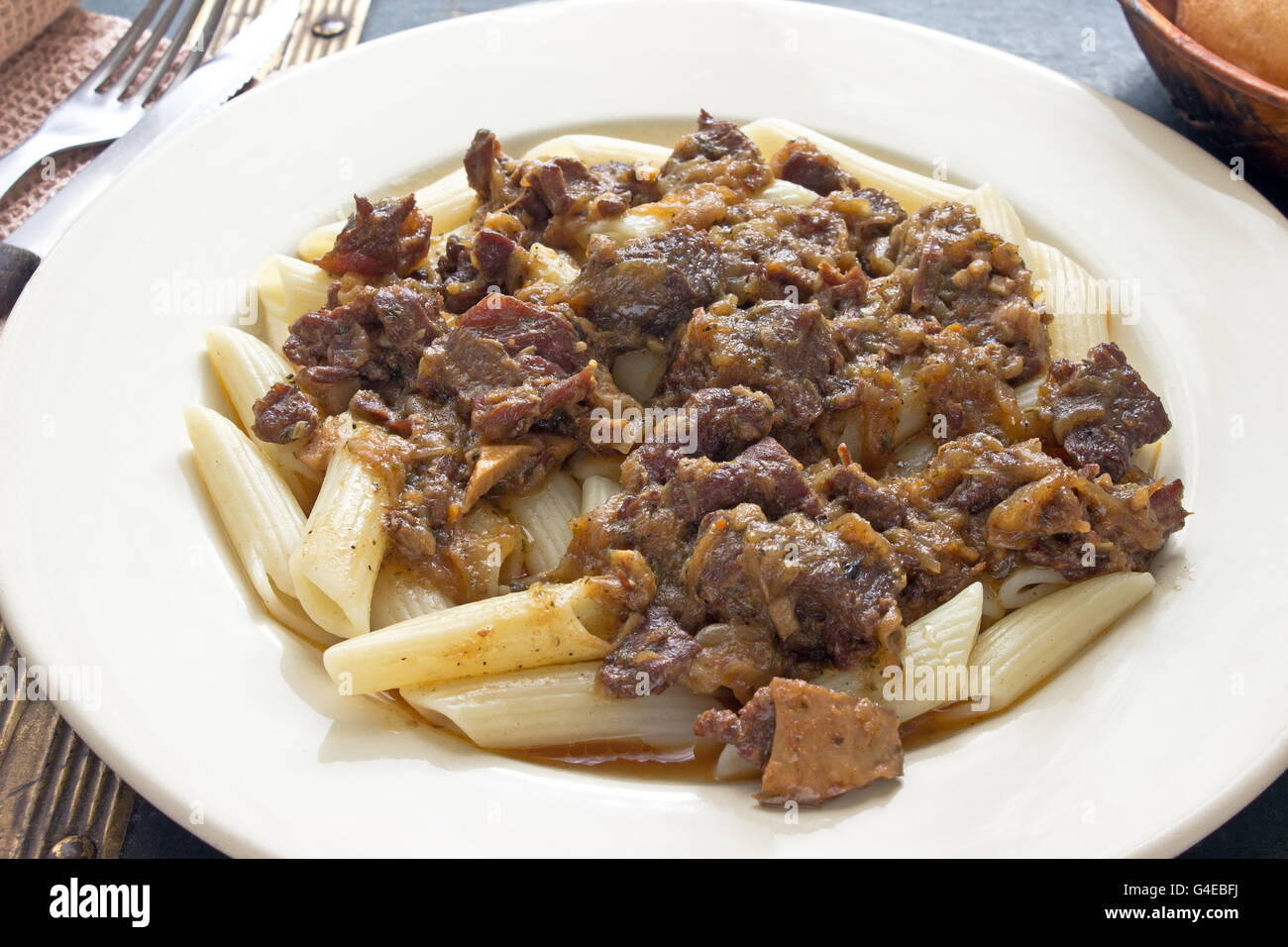Beef goulash with macaroni in plate Stock Photo