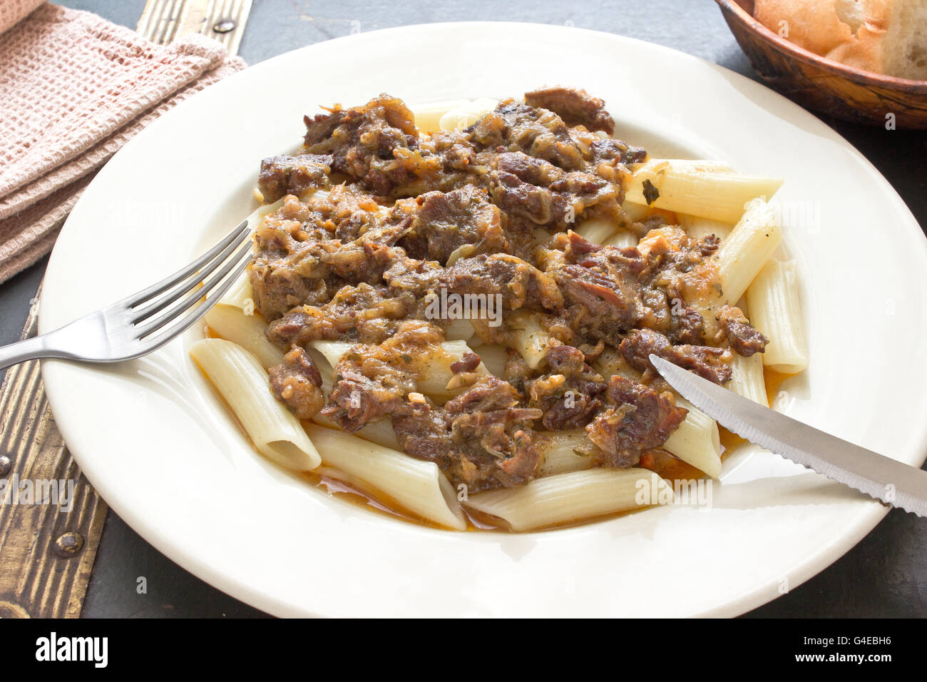 Beef goulash with macaroni in plate Stock Photo