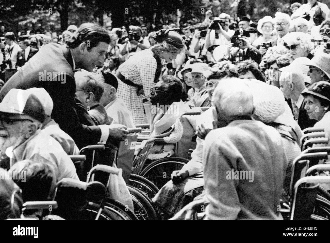 The Prince and Princess of Wales meet a number of people in wheelchairs on their arrival in Halifax, Nova Scotia. Stock Photo