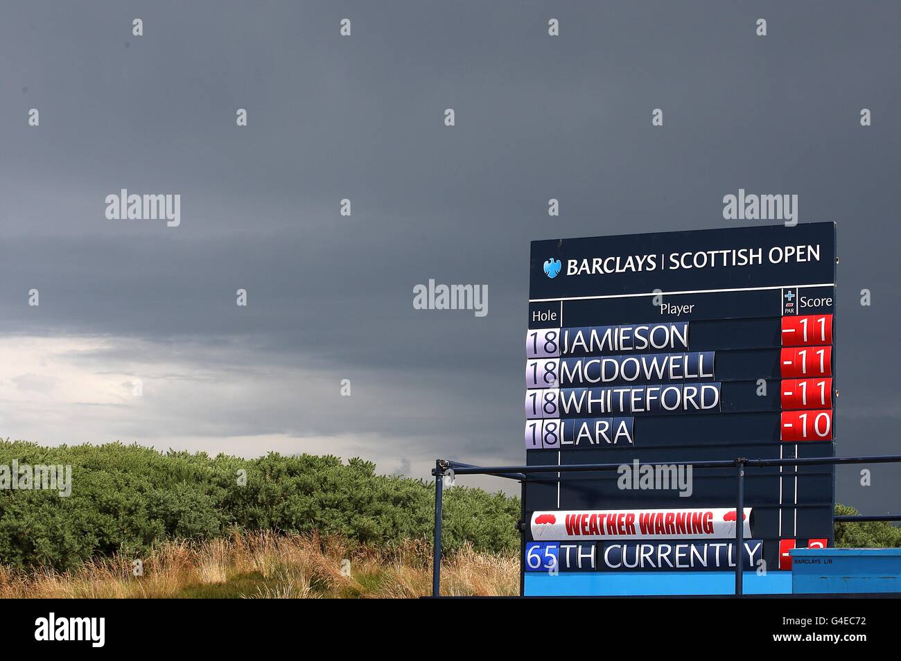 The leaderboard giving a weather warning before play was suspended during Day Two of the Barclays Scottish Open, at Castle Stuart Golf Links, Inverness. Stock Photo