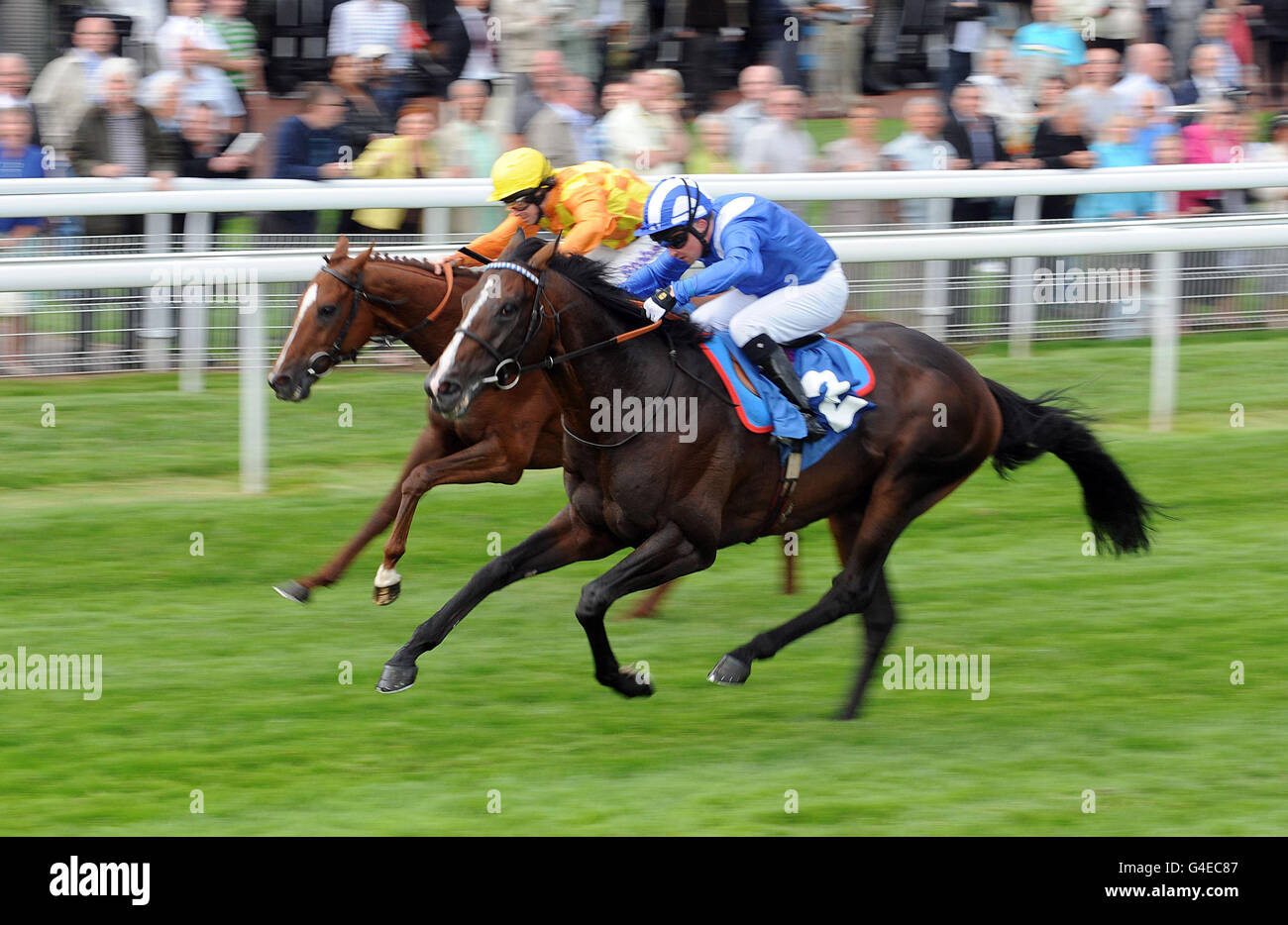 Awsaal ridden by Tadhg O'Shea (right) beats Waldvogel ridden by Tom Eaves to win the Caravan Chairman's Charity Cup during day one of the 52nd John Smiths Cup Meeting at York Racecourse. Stock Photo