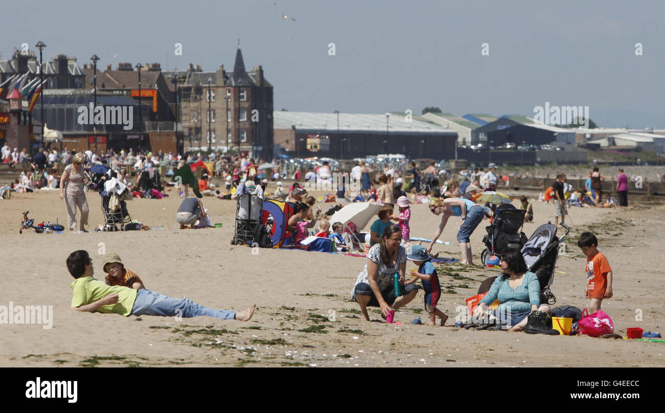 Members of the public enjoy the hot weather on Portobello beach near