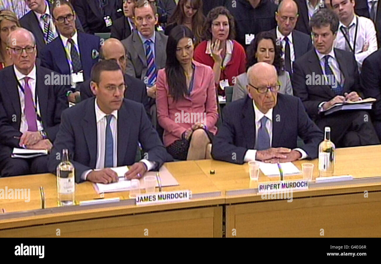 James Murdoch (left) , Deputy Chief Operating Officer and Chairman and Chief Executive Officer, International News Corporation and Rupert Murdoch, Chairman and Chief Executive Officer, News Corporation giving evidence to the Culture, Media and Sport Select Committee in the House of Commons in central London on the News of the World phone-hacking scandal. Stock Photo