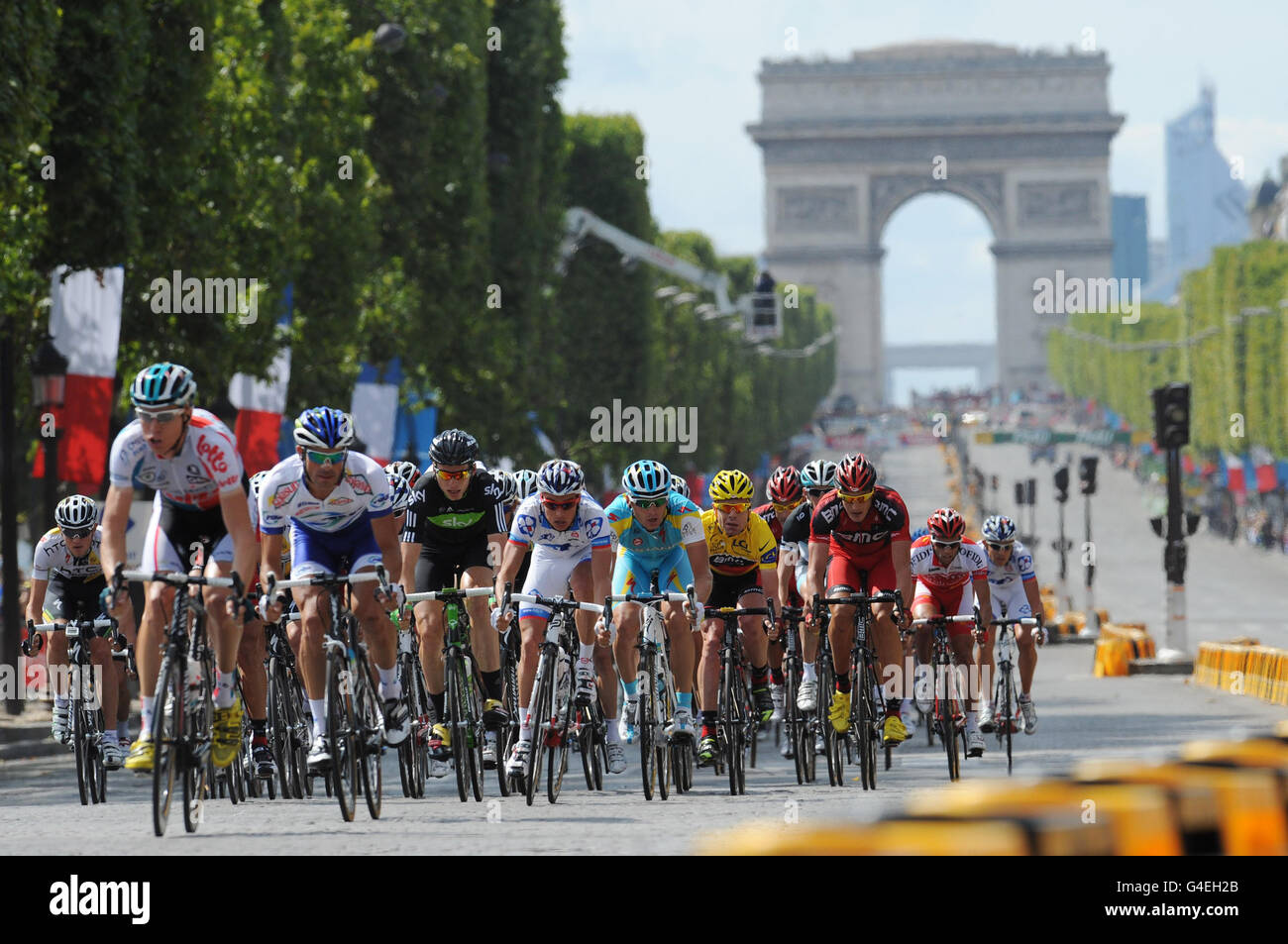 Riders make their way along the Champs-Elysees in Paris, during stage twenty one of the Tour de France from Creteil to Paris, France. Stock Photo