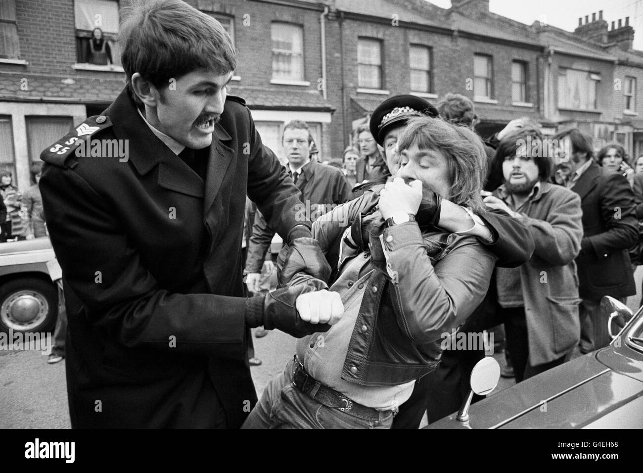 Police restraining pickets outside the Grunwick Processing Laboratories at Willesden, London, who are supporting an official strike by process workers. Stock Photo
