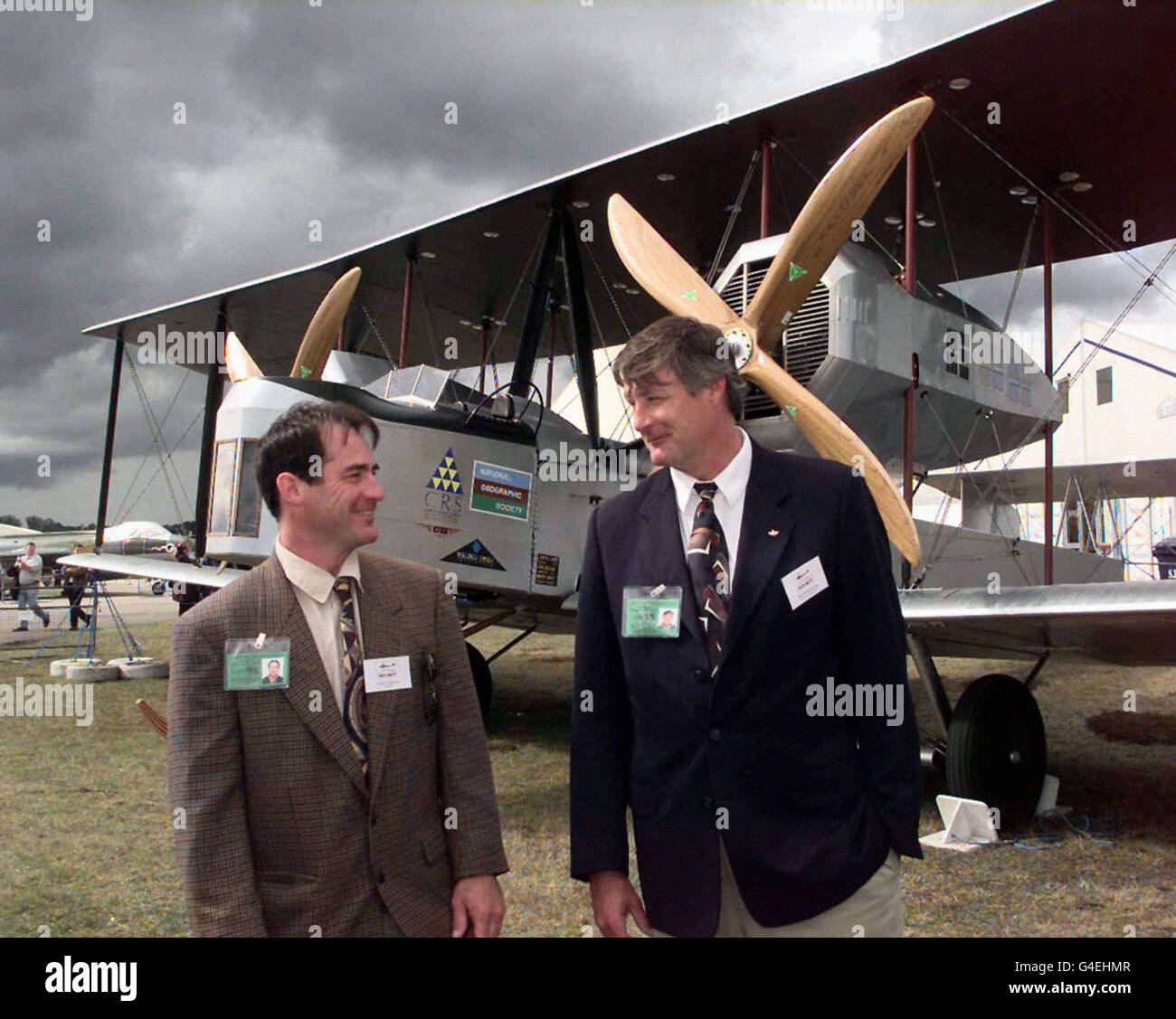 Pilots John LaNoue, left, and Mark Rebholz with the replica version of a Vickers Vimy bomber plane, which is set to re-enact an historic Britain to South Africa flight. The Vimy, called the Silver Queen, has been put through its paces at the Farnborough Air Show. It will leave Brooklands airfield in Surrey to fly 8,500 miles across the Alps, the Apennines, the Greek Isles, the pyramids, the upper Nile, Mt Kilimanjaro and Victoria Falls to South Africa. The flight re-enacts where possible the original 1920 route taken by South African pilots Pierre van Ryneveld and Christopher Quinton Brand Stock Photo