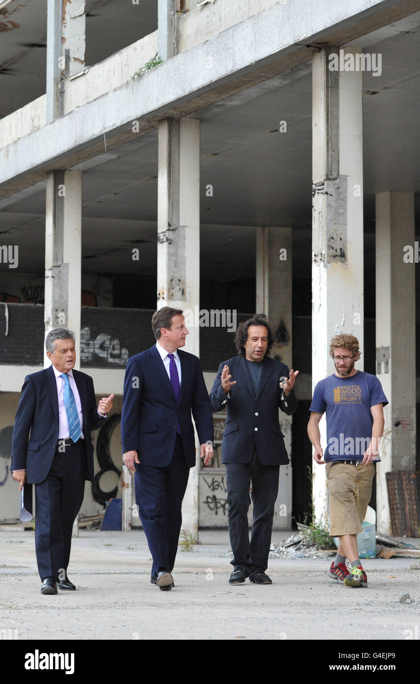 Prime Minister David Cameron speaks with Colin Skellett (left), Chair of the local enterprise