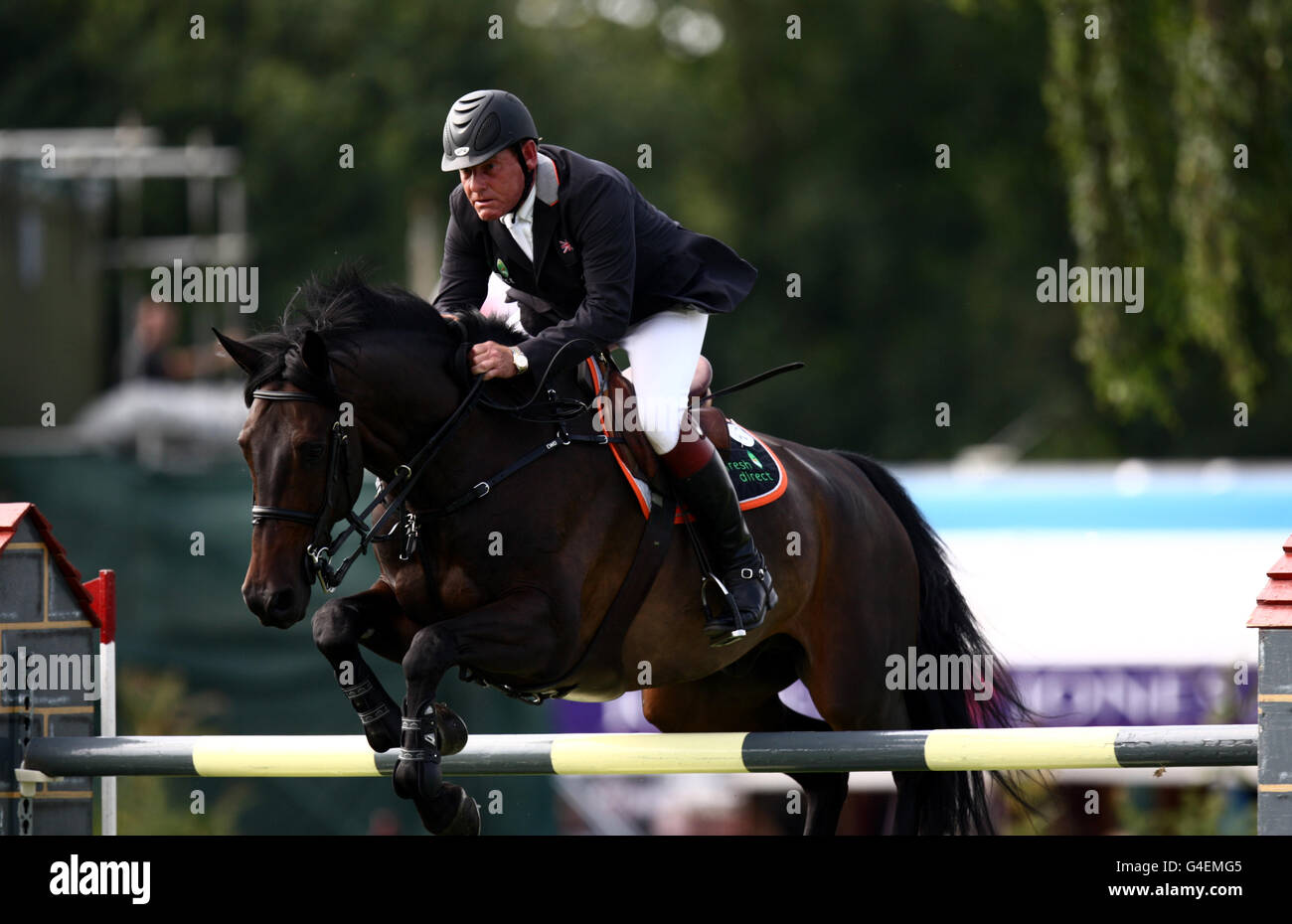 Great Britain's Tim Stockdale rides Fresh Direct Kalico Bay in the Longines King George V Gold Cup during the Longines Royal Hickstead International Horse Show at The All England Jumping Course, Hickstead. Stock Photo