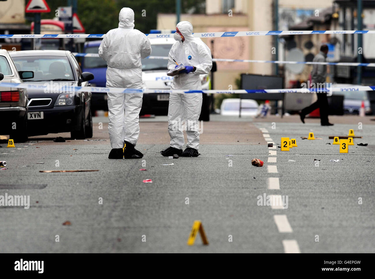 Forensic officers at the scene in the Winson Green area of Birmingham, where three men died after a road traffic collision early this morning. A murder investigation has been launched. Stock Photo