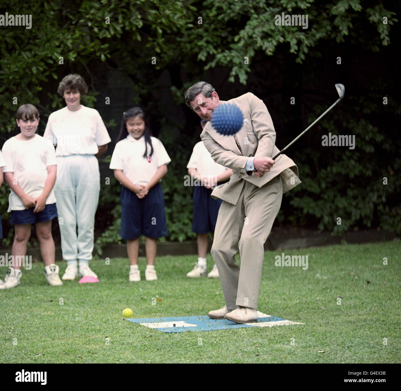 PA NEWS 10/2/94 THE PRINCE OF WALES PLAYS GOLF WITH AN OUTSIZE BALL DURING A VISIT TO A PRIMARY SCHOOL SPORTS DAY IN CHRISTCHURCH ON THE LAST DAY OF HIS VISIT TO NEW ZEALAND. Stock Photo