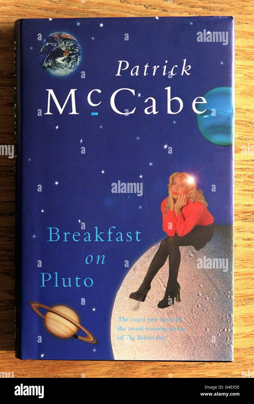 Breakfast on Pluto by Patrick McCabe, one of the Booker Prize works shortlisted for the 1998 award on display at Colman Getty's offices in London today (Thursday). Judges have been locked in a room at London gentlemen's club, the Savile Club, for more than four hours today thrashing out their views. Each of the judges is expected to read all 125 books submitted for the prize, which has been reduced to this final six. See PA Story ARTS Booker. Photo by Peter Jordan/PA. Stock Photo