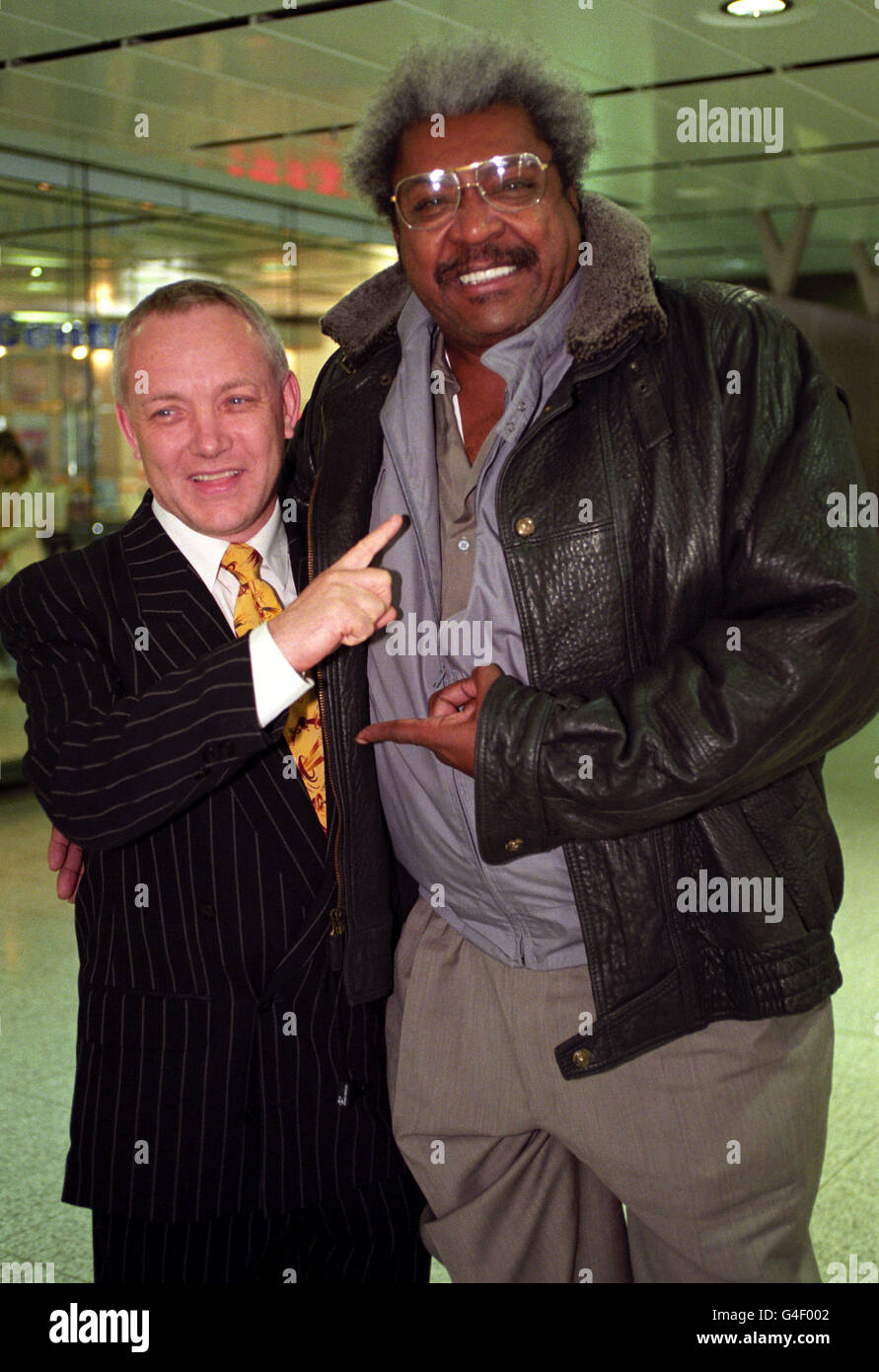 Larger-than-life American promoter Don King, right, meeting with boxing manager Frank Maloney, who represents WBC champion Lennox Lewis, in London, after Mr King made a forthright claim he is going to give the world the title the match it demands - Lennox Lewis against Evander Holyfield. Stock Photo