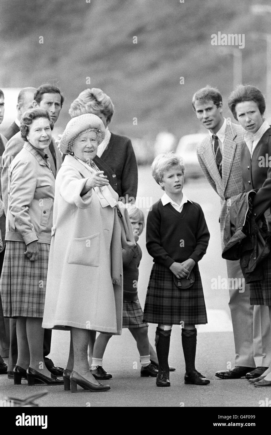 The Queen Mother points the way to the Queen, the Prince and Princess of Wales, Prince Edward, Princess Anne and her children Zara and Peter Phillips, when she greeted them at the small Scottish port of Scrabster as they disembarked from the Royal Yacht Britannia. Stock Photo