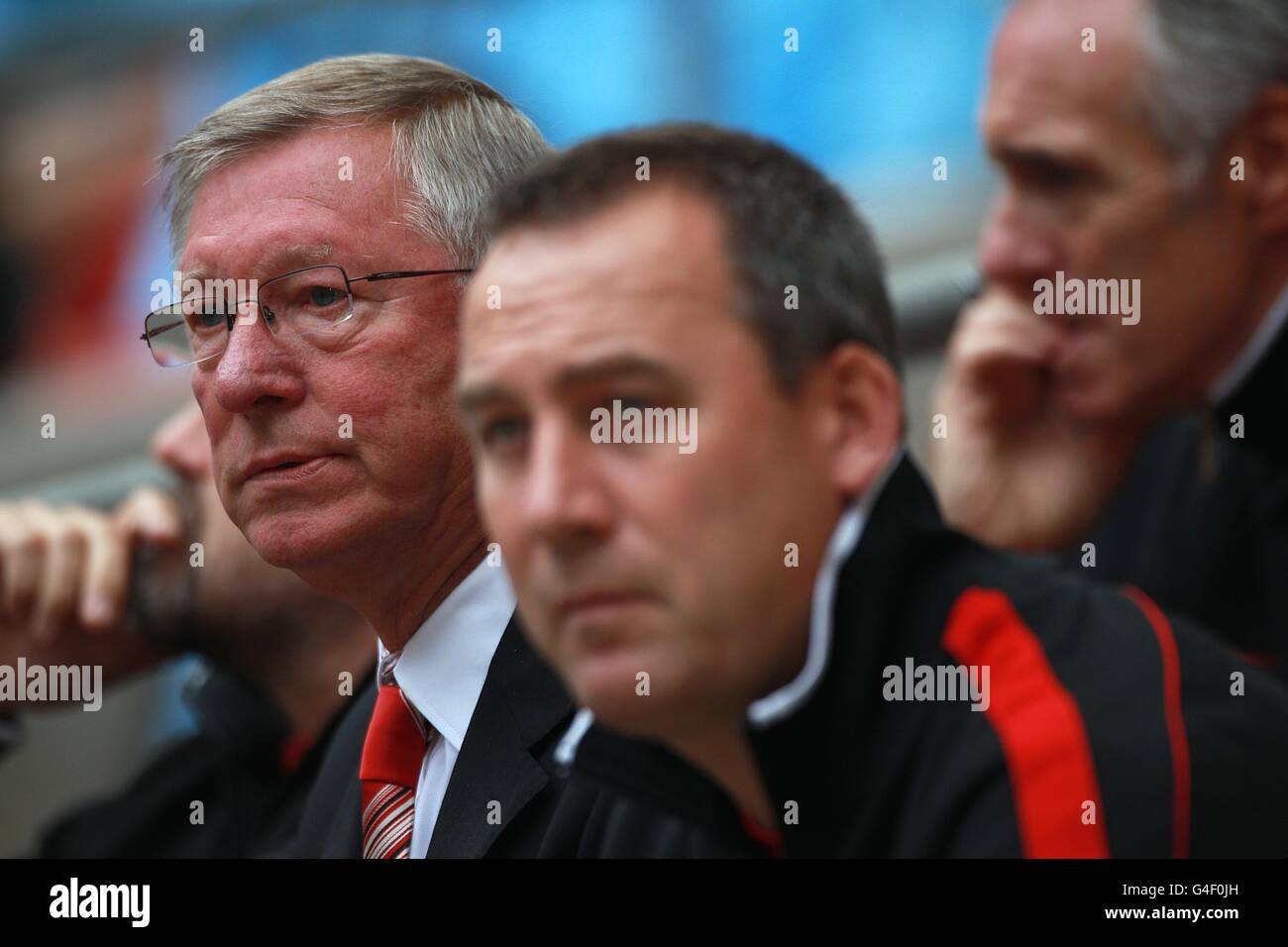 Soccer - FA Community Shield - Manchester City v Manchester United - Wembley Stadium. Manchester United manager Alex Ferguson (left) looks on from the bench Stock Photo