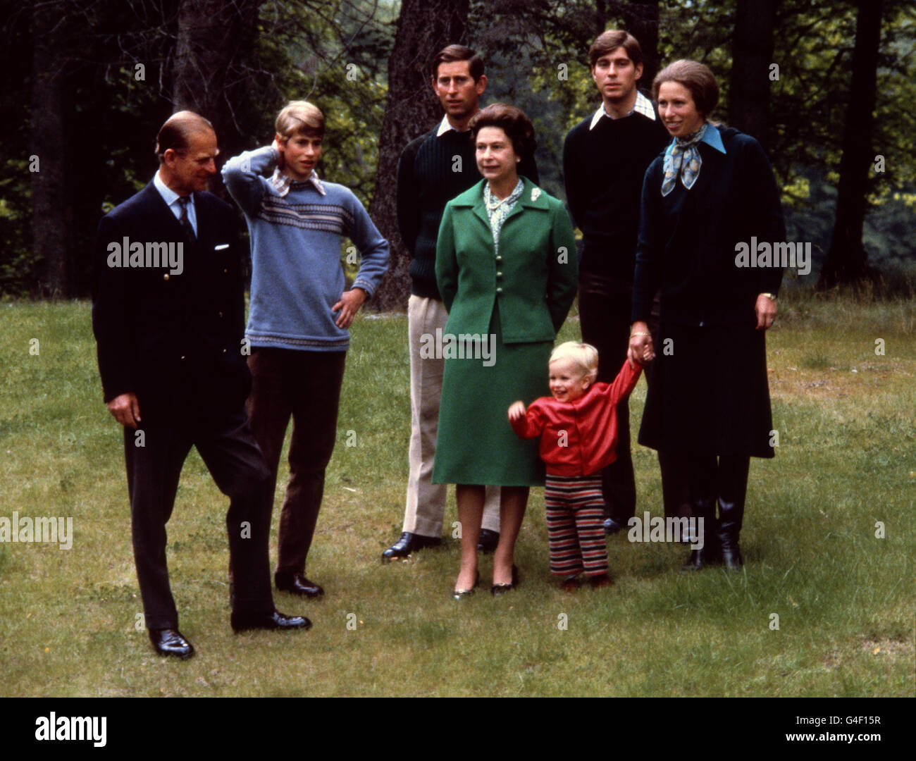 Queen Elizabeth II with the Duke of Edinburgh and their sons, left to right, Prince Edward, Prince Charles and Prince Andrew, and daughter Princess Anne with her son Peter Phillips at Balmoral. Stock Photo