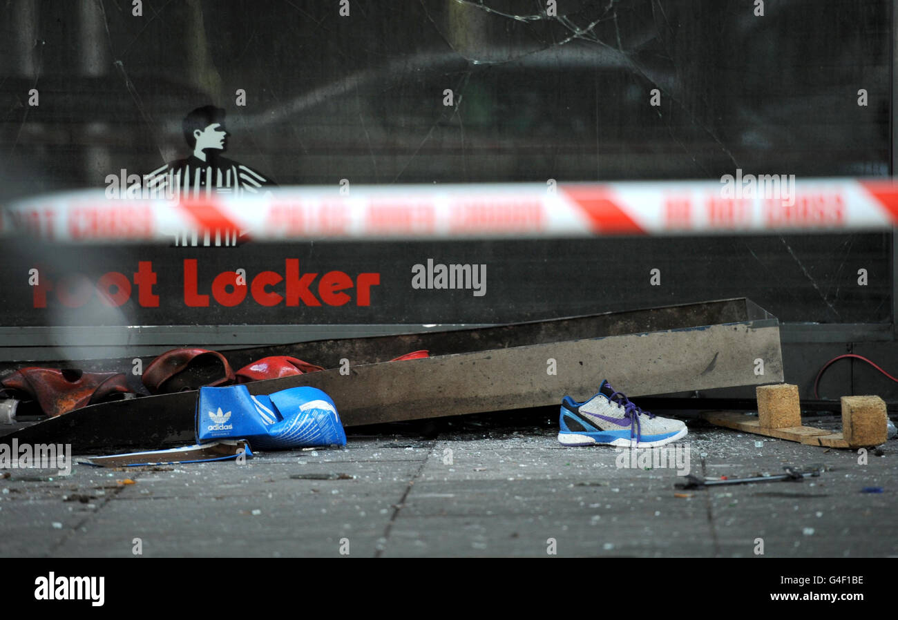 Debris outside a Foot Locker store in Brixton, south London, after a second night of rioting in the capital. Stock Photo