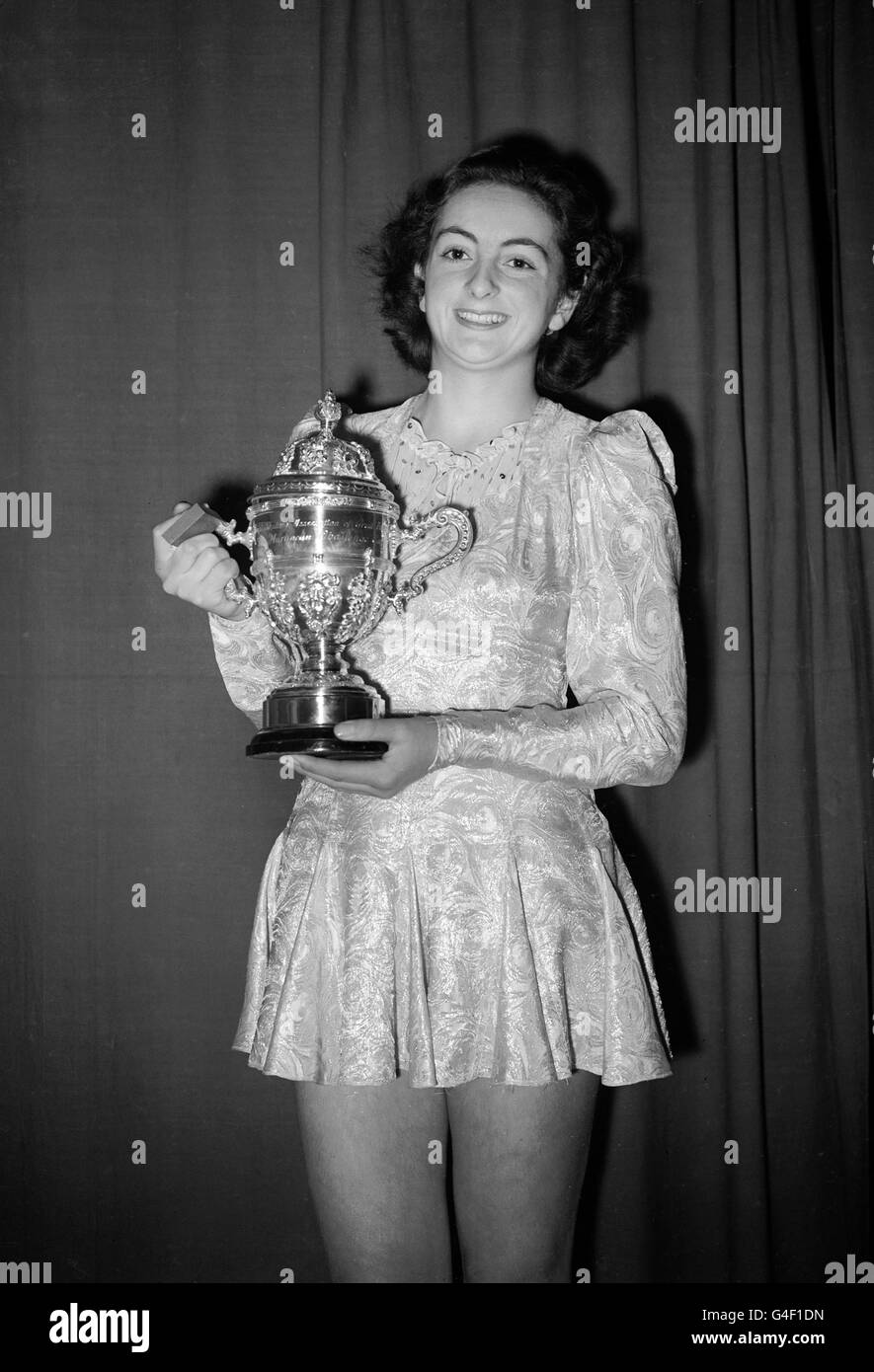 Jeanette Altwegg poses with the trophy after winning the British Amateur Ice Figure Skating Championship at Wembley Stock Photo