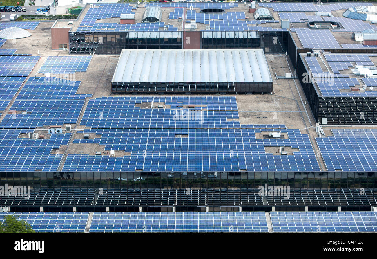 Large solar panels on a flat roof, exhibition hall of the exhibition in Brussels, trade fair hall, Belgium, Stock Photo