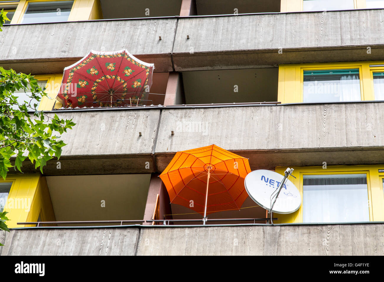 Balconies in a large residential complex, parasols, satellite antenna, Stock Photo