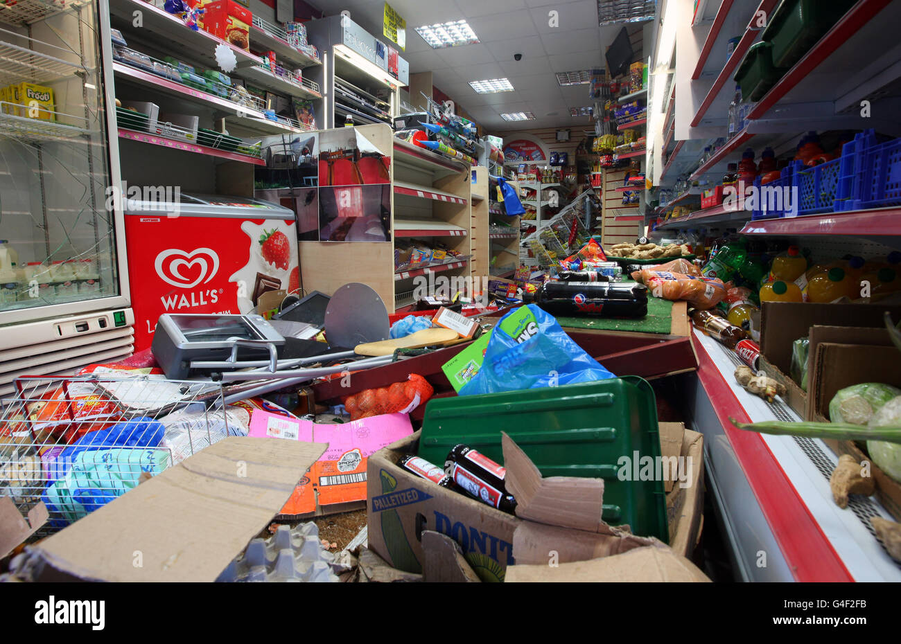 An internal view of damage to shop on London Road in Croydon, Surrey, following a a third night of civil unrest on the streets of London. Stock Photo