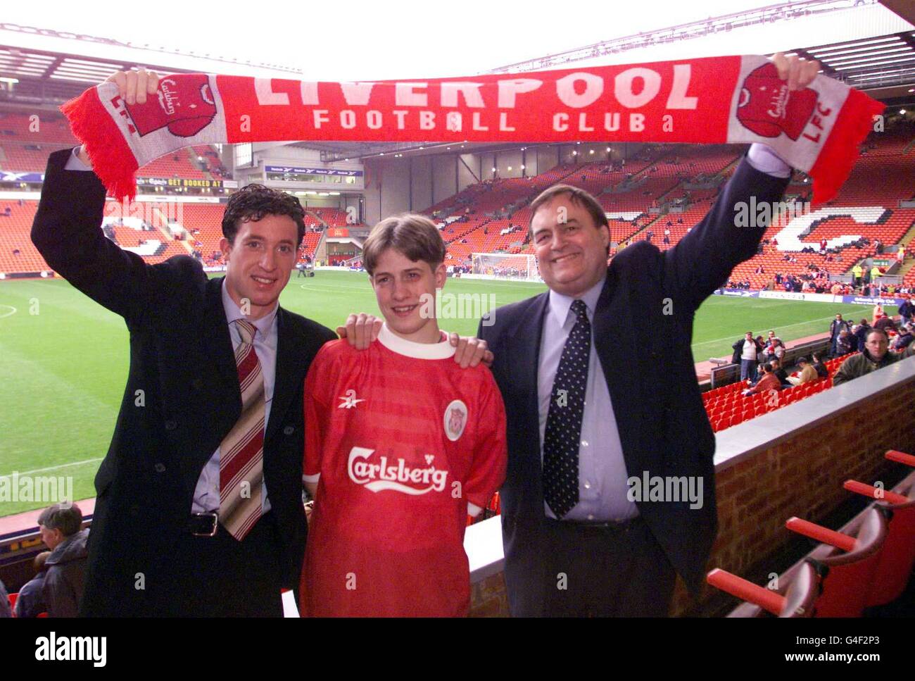 Ronan McGrory, (centre) an Omagh bombing survivor with Liverpool striker Robbie Fowler(left) and Deputy Prime Minister John Prescott at the Liverpool versus Nottingham Forest FA Carling Premiership match, Anfield today (Saturday). Liverpool fan Ronan asked on waking up in hospital what the Liverpool score was and Prescott who was visiting the hospital the day after the bombing promised to take him to the game when he recovered. Watch for PA story. Photo by Owen Humphreys/PA Stock Photo