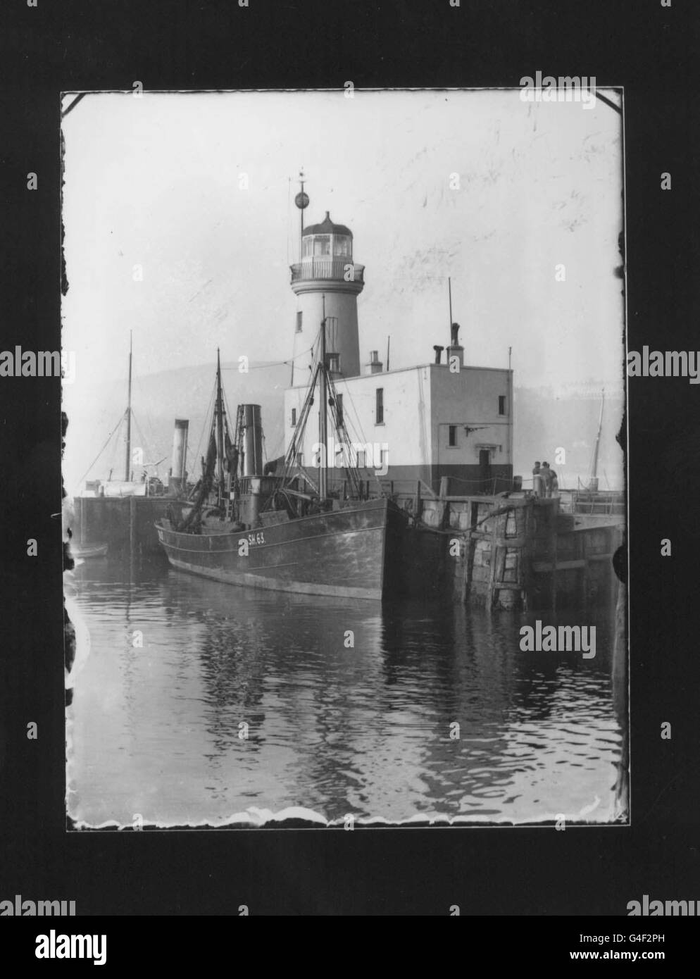 Williams Wells shot of the lighhouse in Scarborough. A treasure trove of Victorian photography, hidden for nearly 100 years has been discovered in a garage in Grimsby. The collection of high quality glass negatives and magic lantern slides, which will be sold with the cameras next week, were shot by Yorkshireman William Wells between 1899 and 1901. PA Photos. See PA story SOCIAL Photos Stock Photo