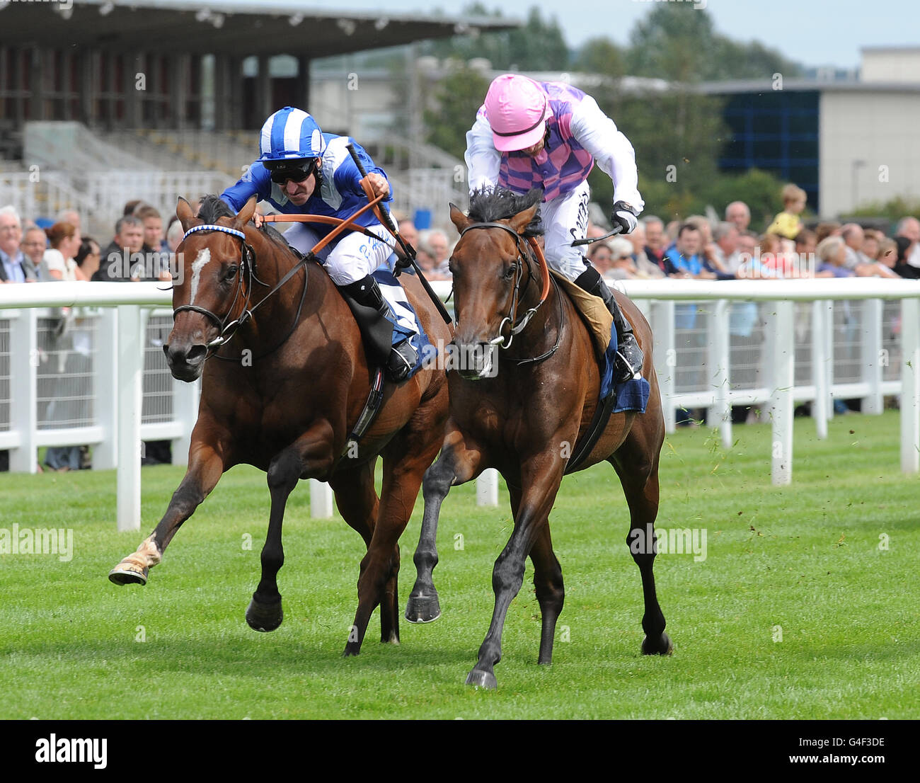 Tales of Grimm ridden by Kieren Fallon (right) winners of The Don Deadman Memorial European Breeders' Fund Maiden Stakes (Div 1) from Firdaws ridden by Richard Hills Stock Photo