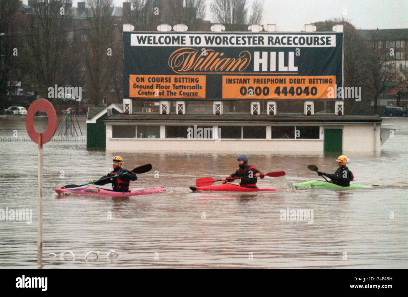 Canoeists paddle past the winning post at the flooded Worcester Race course today (Saturday). Photo by Toby Melville/PA. See PA story WEATHER Floods Stock Photo