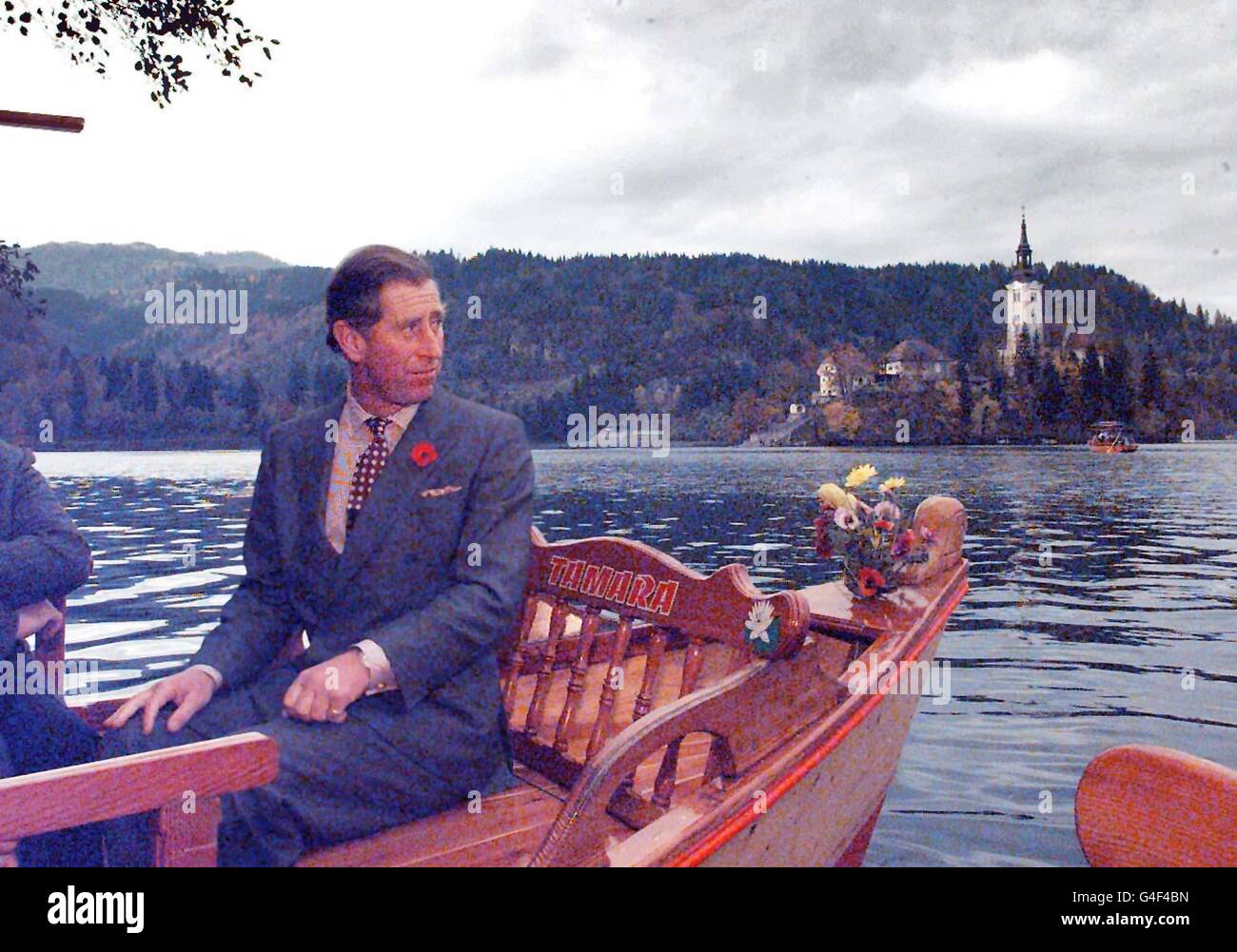 The Prince of Wales admires the view of the Castle in the centre of Lake Bled, during a rowing boat crossing to see the beauty spot in Slovenia Monday November 2, 1998. PA photo: John Stillwell. See PA story ROYAL Prince **EDI** Stock Photo