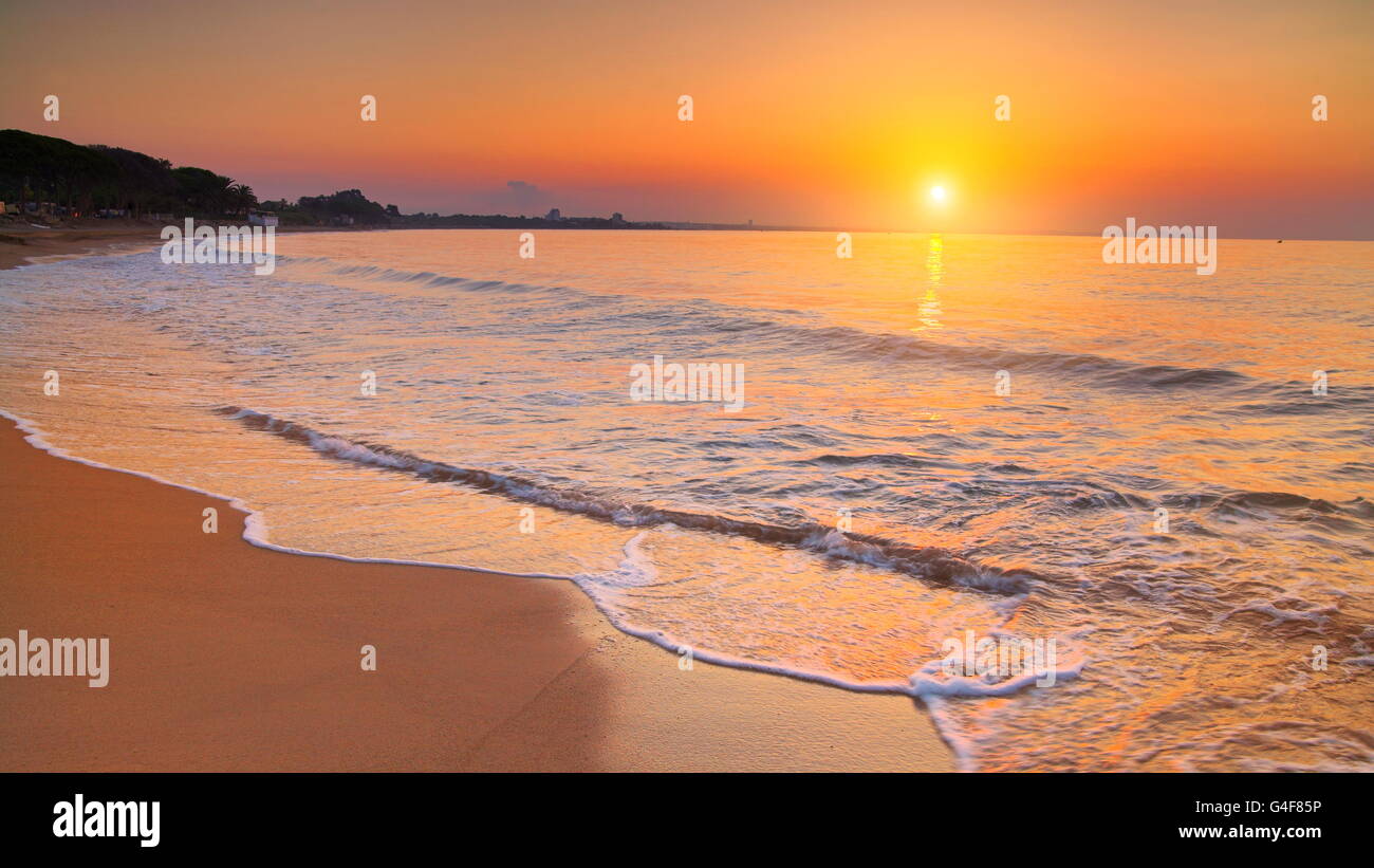 Sunset at Costa Dorada Beach, Spain Stock Photo