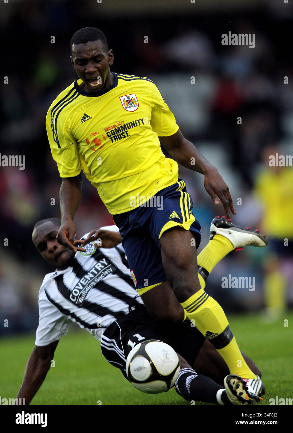 Bristol City's Yannick Bolasie is tackled by Kieron Forbes of Forest green Rovers during the pre season friendly match at the New Lawn, Forest Green, Nailsworth Tuesday July 26, 2011. Photo credit should read: David Davies/PA Wire. Stock Photo