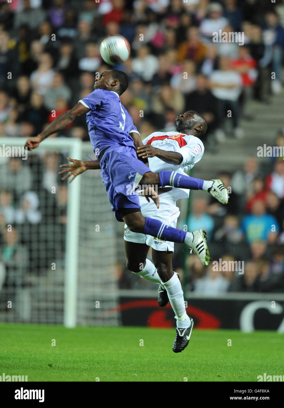 Milton Keynes Dons' Jabo Ibehre and Tottenham Hotspur XI's Danny Rose Stock Photo