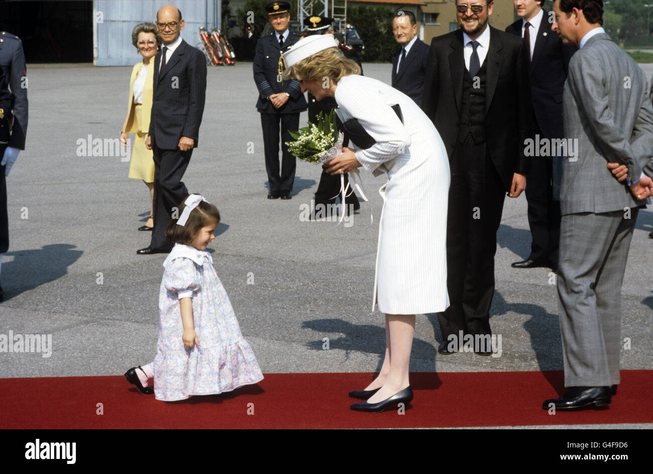 The Princess of Wales receives a nosegay from a small girl during her visit to La Spezia, Italy. Stock Photo