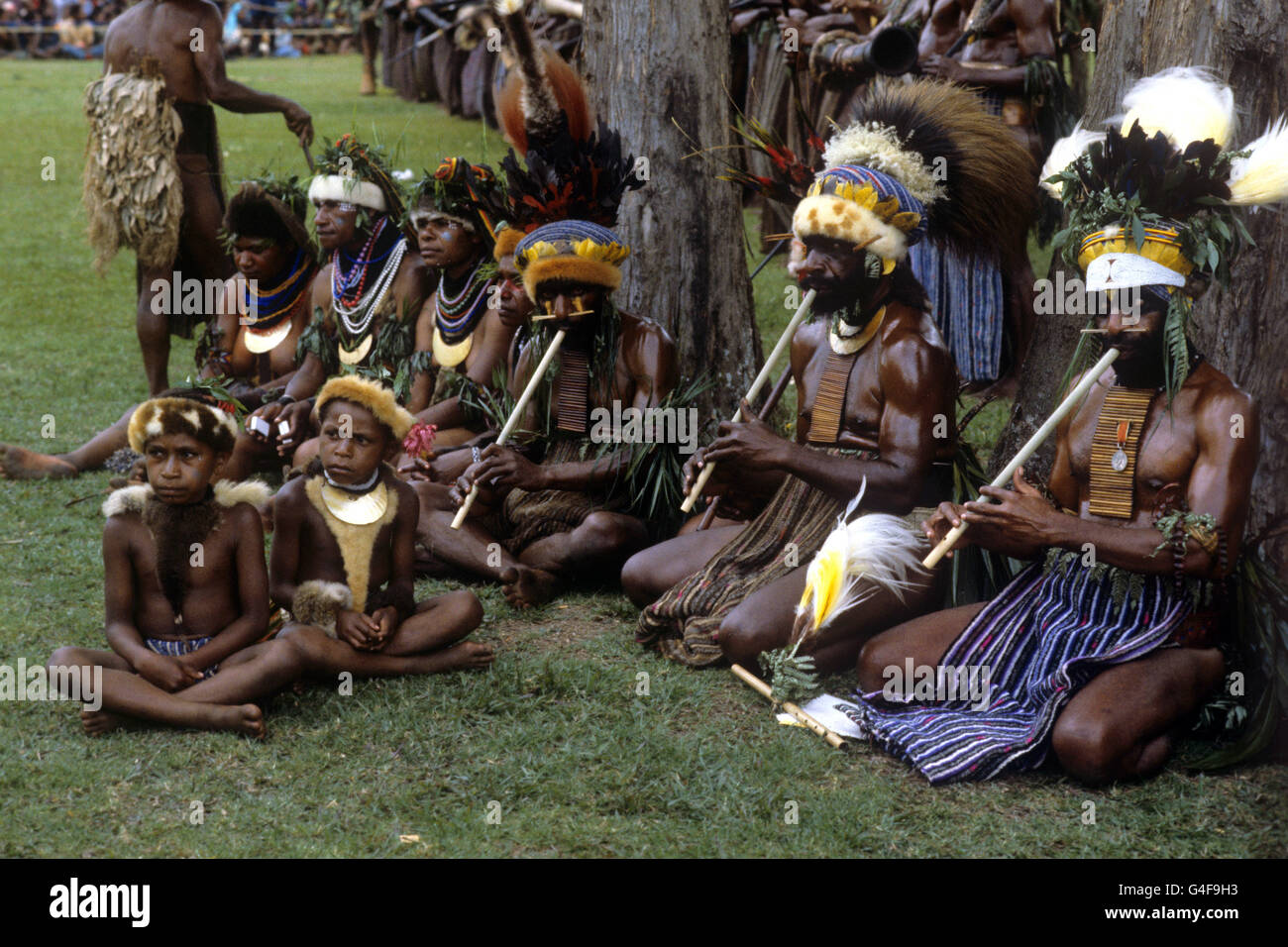 Tribal musicians play their reed like instruments during the Singsing