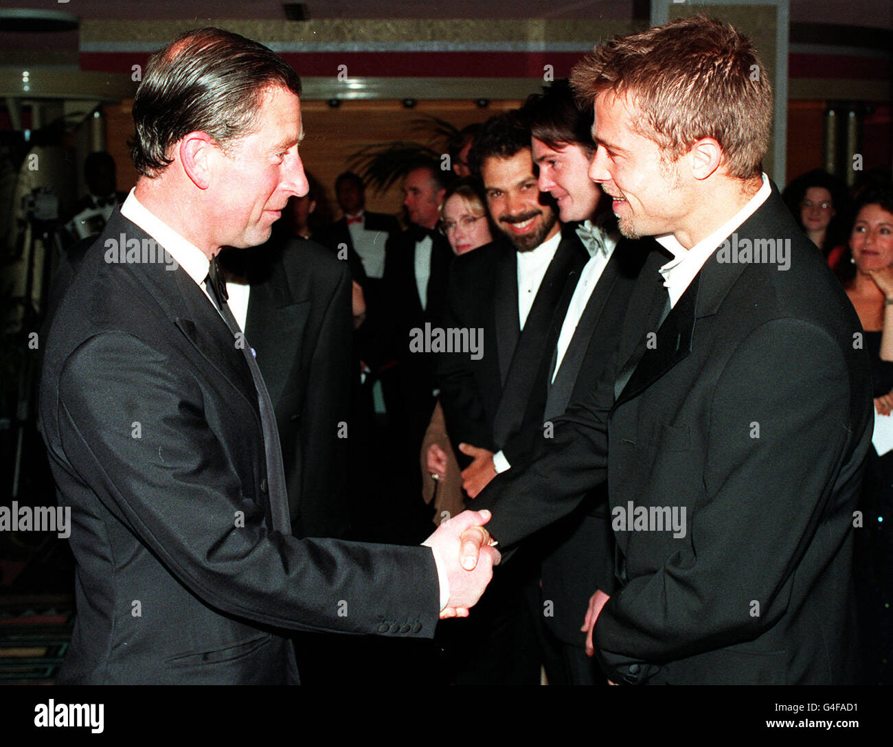 THE PRINCE OF WALES (LEFT) SHAKES HANDS WITH AMERICAN ACTOR BRAD PITT