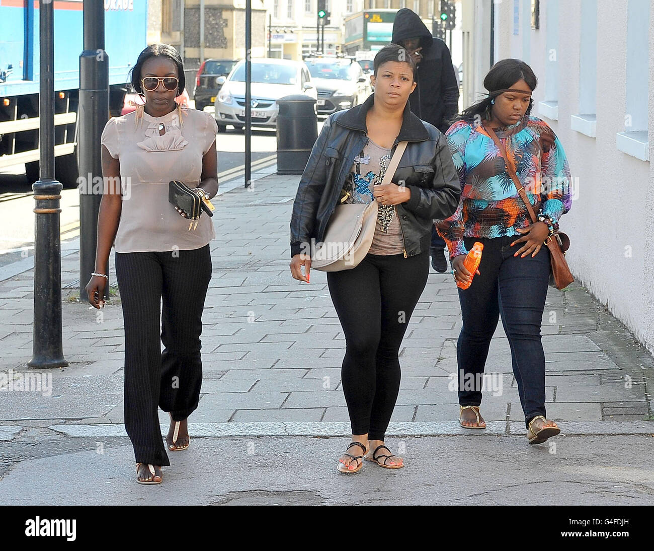 Semone Wilson, fiancee of Mark Duggan, (left) arrives with two unidentified women at North London Coroner's Court in High Barnet. Stock Photo