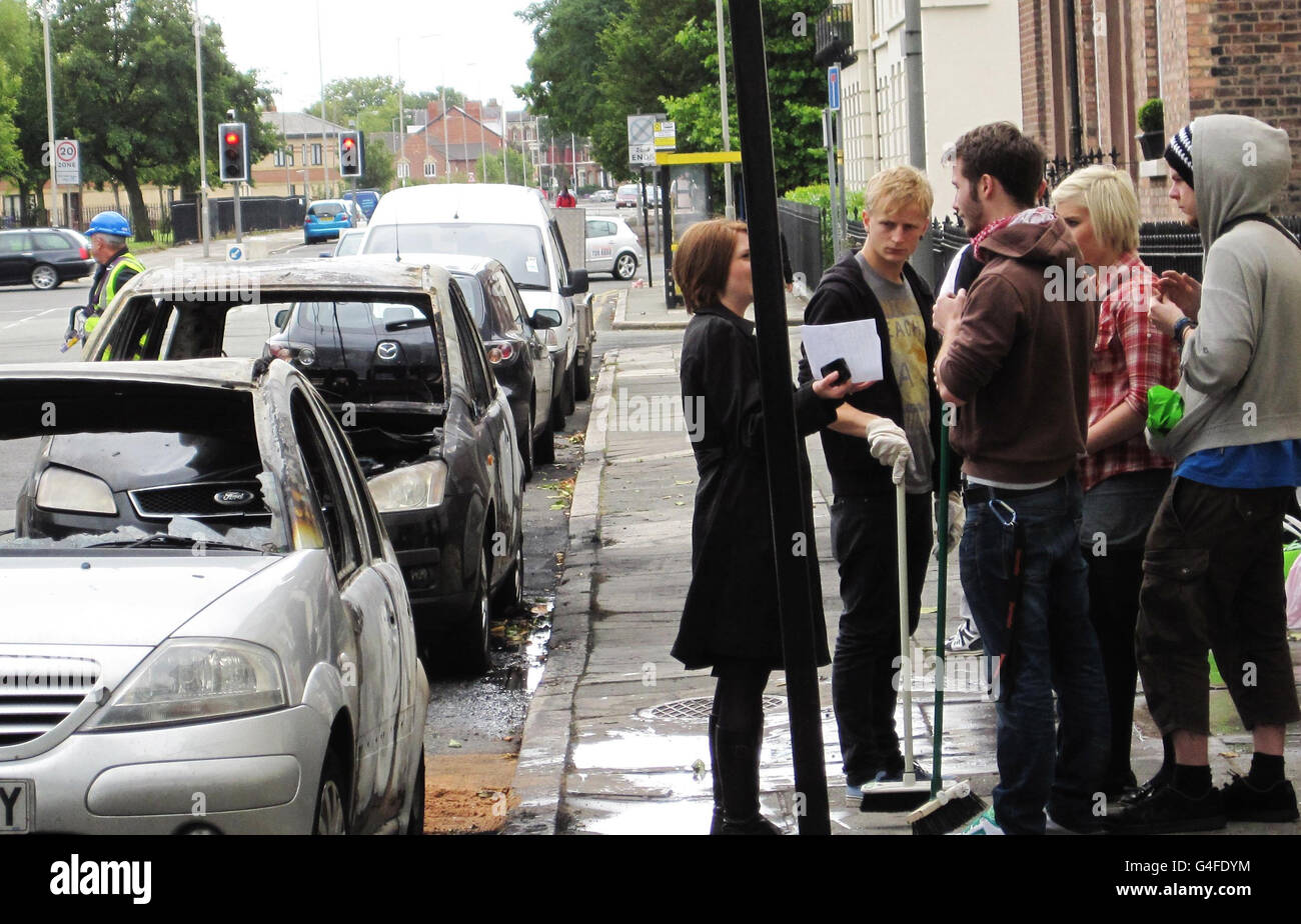 Volunteers who formed after a Facebook campaign to Clean up Liverpool take a break from cleaning