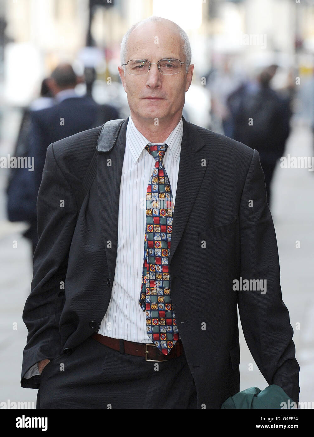 Dr William Bassett arrives at the GMC in Manchester where he is due to give evidence in his fitness to practice hearing. He is accused of misconduct over an overdose of diamorphine he gave to a terminally ill lung cancer sufferer. Stock Photo
