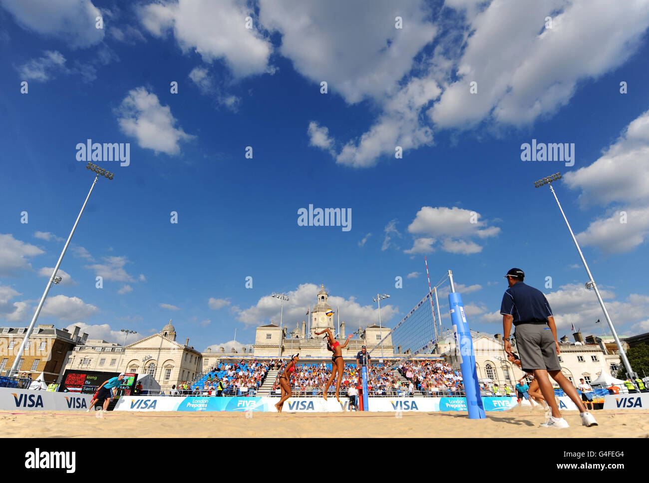 General view of the arena during the the preliminary phase match between China's Fan Wang and Yuanyuan Ma and Puerto Rico's Yarleen Santiago and Dariam Acevedo during the FIVB Beach Volleyball International at Horse Guards Parade, London. Stock Photo