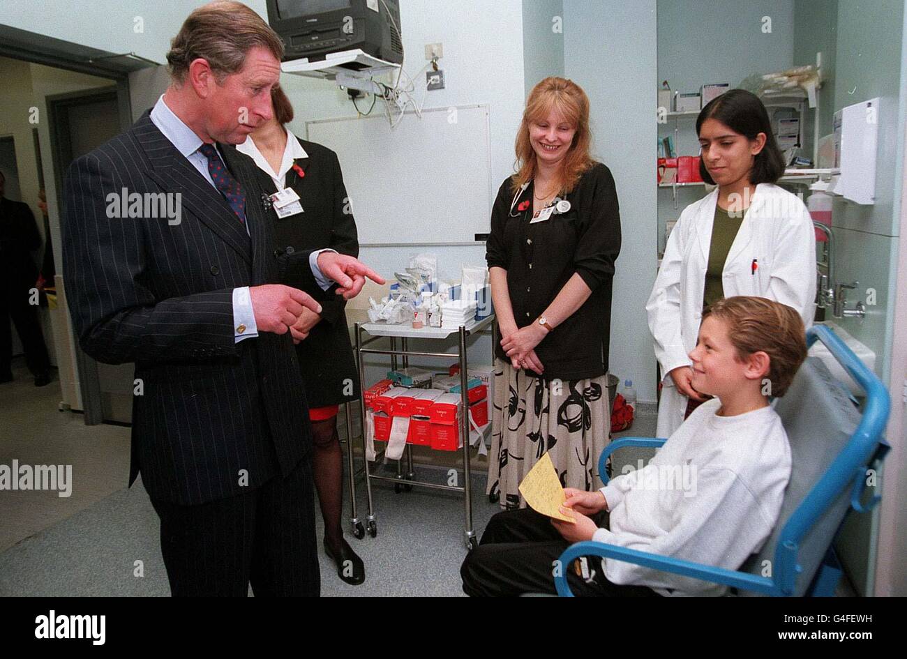 Prince Charles greets Scott Smith, aged 9 from Forest Hill in London as he opens the re-developed Accident and Emergency and Radiology Departments at King's College Hospital today (Wednesday). Pool photo from Evening Standard. Stock Photo