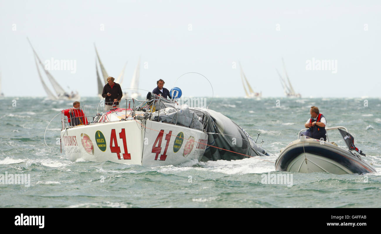 Marco Nannini and his yacht Eutourist Serv-System retire after being dismasted early in the 44th Fastnet Race on The Solent. Stock Photo